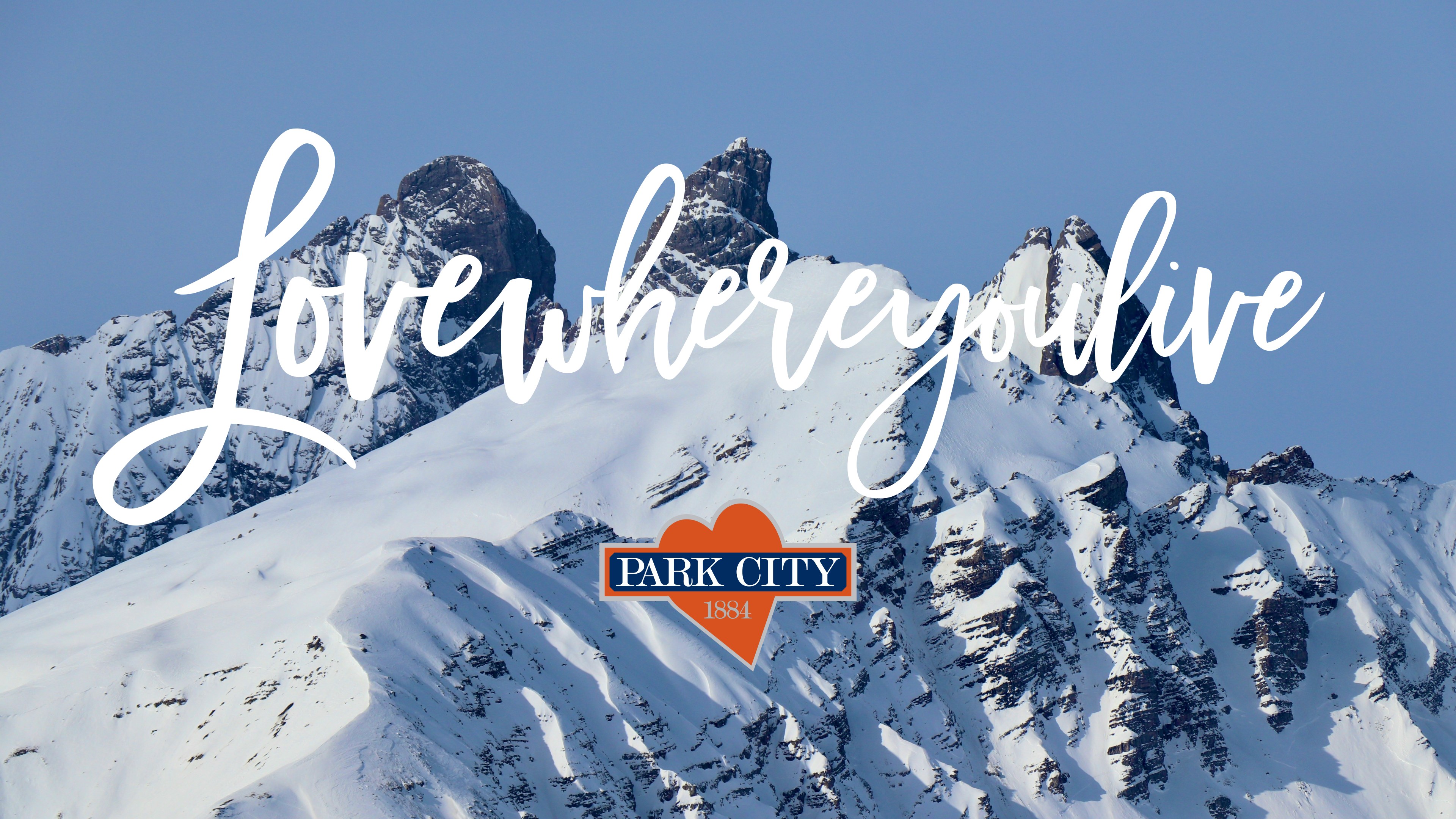 Love where you live over snowy peaks, with the Park City mark and heart