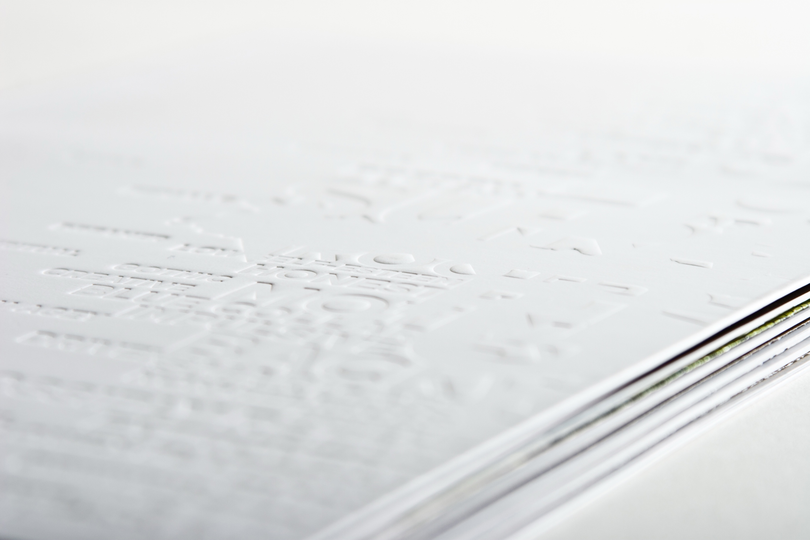 Close-up of embossed white typography